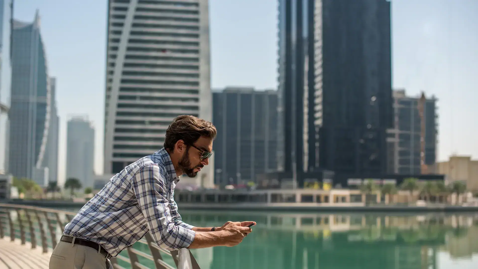 man looking at his phone in Dubai