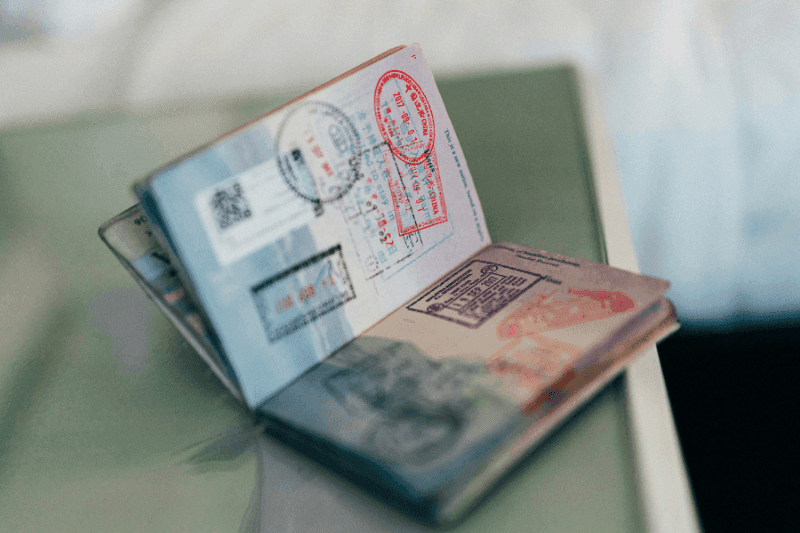 Visualising an open passport with visa stamps for digital nomad visa France options
