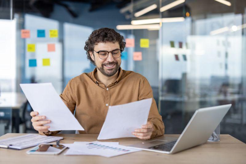 Freelancer reviewing contract documents to compare employment options